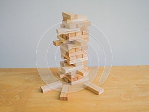 Wood block tower with architecture model, Planning Alternative Risk and Strategy in Business concept