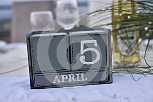 Wood blocks in box with date, day and month 5 April