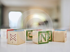 Wood blocks, table and letters for learning, education or childhood development at home. Colorful wooden cube toys to