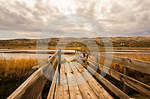 Wood boardwalk leading to a saline