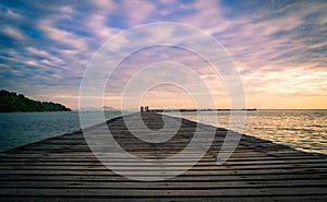 Wood bridge pier with beautiful sunrise sky and clouds