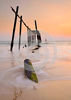 Wood bridge with seascape at sunset