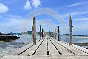 Wood bridge to the sea at samaesarn thailand photo