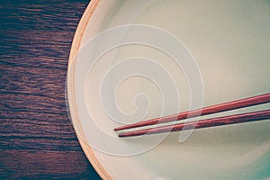 Wood brown chopsticks and celadon green ceramic