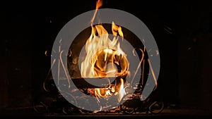 Wood burning fireplace at night in winter season