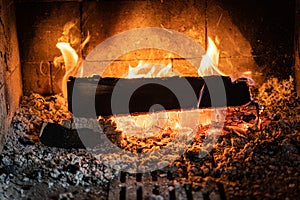 Wood burning inside a fireplace. Fireplace live fire