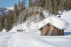 Wood cabin hut in the winter snow background