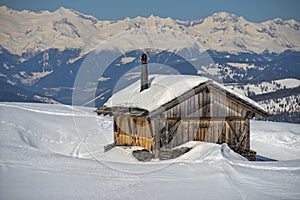 Wood cabin hut in the winter snow background