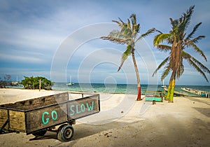 Wood Cart with Go Slow message at Caye Caulker - Belize