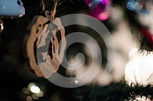 A wood carved Christmas tree ornament