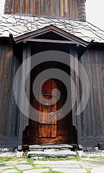 Wood carved door of Torpo stave church in Ål i Hallingdal in Norway in autumn