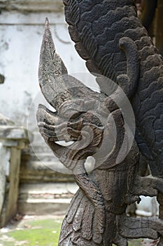 Wood carved Naka in Shwenandaw Kyaung Temple in Mandalay, Myanmar.