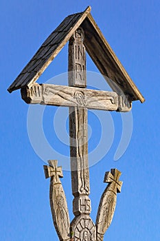 Wood carved orthodox cross with shingle roof protection