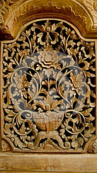 Wood carving, floral pattern carved on wooden background. gebyok.