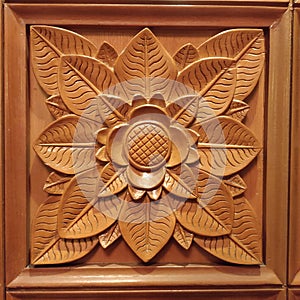 Wood carving on a flower-shaped door inside the Shangrila Hotel Surabaya Indonesia