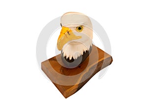 Wood carving of raptor head