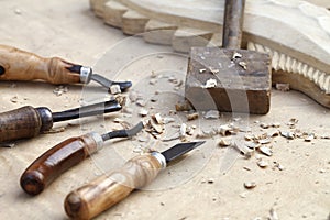 Wood carvings, tools and processes work closeup
