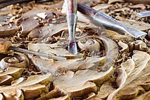 Wood carvings, tools and processes work closeup