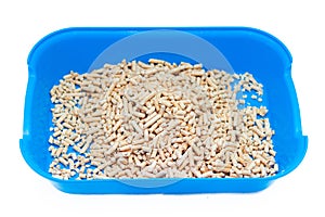 Wood cat litter on a white background. Pets Article about the cat`s toilet and the smell from it. Cat odor neutralizer