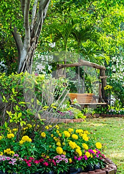 Wood chair in the flowers garden.