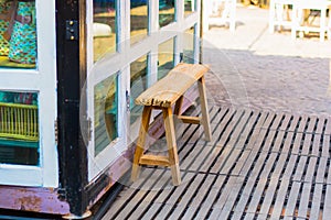 Wood chair porch store front, vintage image.