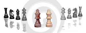 Wood chess pieces isolated on a white background.