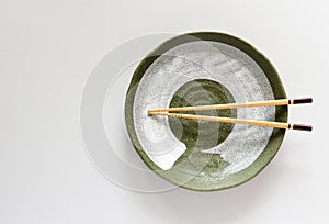 Wood Chopsticks on Ceramic plate green oriental style