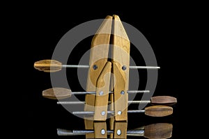 Wood clamps on a reflective surface