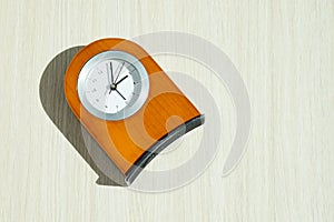 Wood clock on wood background