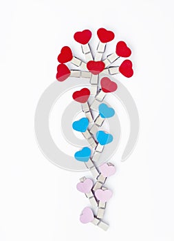 Wood clothes pins with heart shape in flowers patterns design  isolated on white background , clipping path