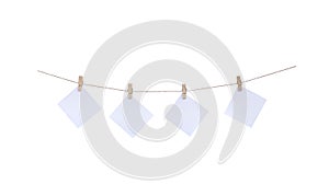 Wood clothes pins with paper hanging on rope isolated on white background , clipping path