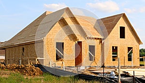 Wood Covered Frame of a Suburban Home Under Construction