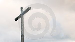 Wood cross on blue sky and copy space. Christian background, spiritual scene