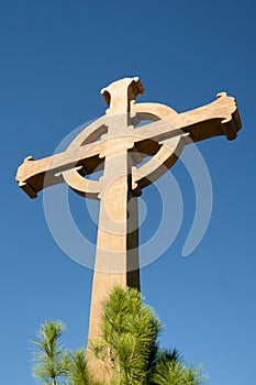 Wood Cross at Monastery backed by Blue sky photo