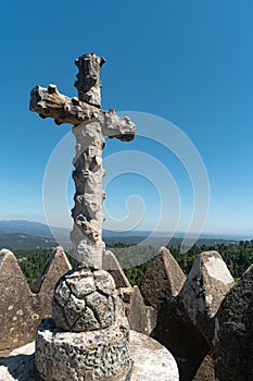 Wood cross in the way to the cross, via crucis, trail on ancient forest of Bussaco, in Luso, Mealhada, Aveiro in Portugal