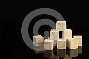 Wood cube block puzzle on black background