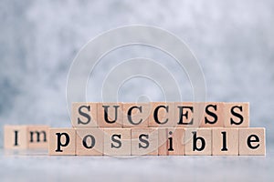 Wood cube letter word of possible and success. Idea of motivation and inspiration in business vision and corporate management