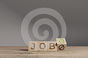 Wood cubes with acronym `JOB` on a beautiful wooden table, studio background. Business concept and copy space