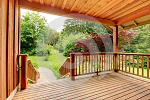 Wood deck with fence and pathed walkway.