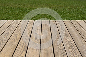 Wood deck and grass background