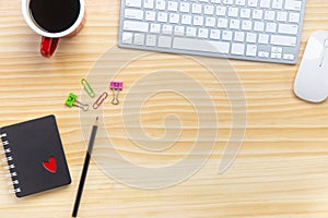 wood desk office with laptop, smartphone and other work supplies with cup of coffee. Top view with copy space for input the text.