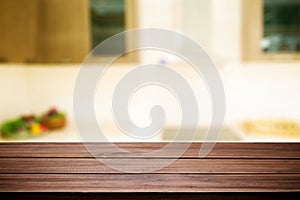 Wood desk space and blurred of kitchen background. for product d