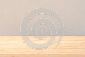 Wood desk tabletop texture isolated on concrete wall background