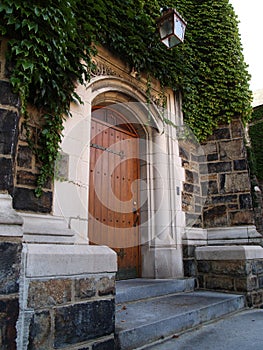 Wood door and ivy covered stone building