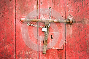 Wood door with lock chain red color old rustic texture