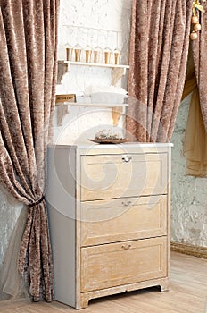 Wood drawer. Interior, beige color. Interior in restaurant. Curtain