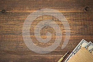 Wood Empty Background With Notebook, Money And Golden Pen