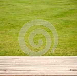 Wood Empty material wooden, deck, table with green field background. for product display montage..