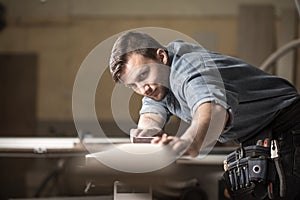 Wood expert checking board's quality