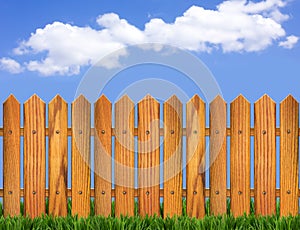 Wood fence and blue sky horizon